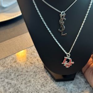 Designer charms Dior 1 of each winners choice YSL sold